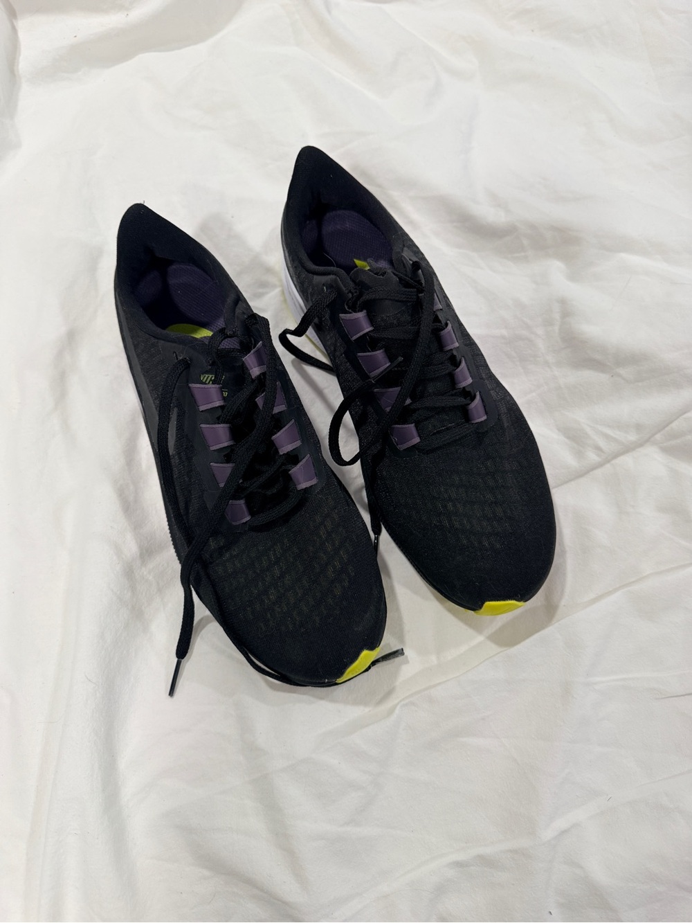 Nike Women's Black Running Shoes with Purple and Yellow Accents